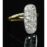 An Art Deco diamond set fingerline plaque ring