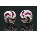 A pair of 18ct white gold diamond and ruby tourbillon earrings,