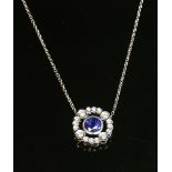 An 18ct white gold sapphire and diamond slide pendant,