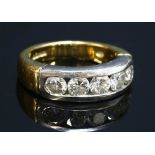 An 18ct gold diamond set half hoop ring,