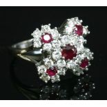 A white gold ruby and diamond cinquefoil cluster ring