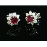 A pair of 18ct white gold ruby and diamond cluster earrings