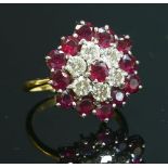 A gold ruby and diamond hexagonal cluster ring