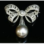 A white gold Tahitian cultured pearl and diamond bow brooch