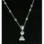 An 18ct white gold diamond set Edna May pendant,