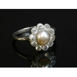 An Art Deco split pearl and diamond daisy cluster ring