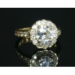 A gold diamond set Daisy cluster ring