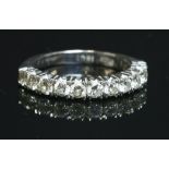 A white gold diamond set half eternity ring