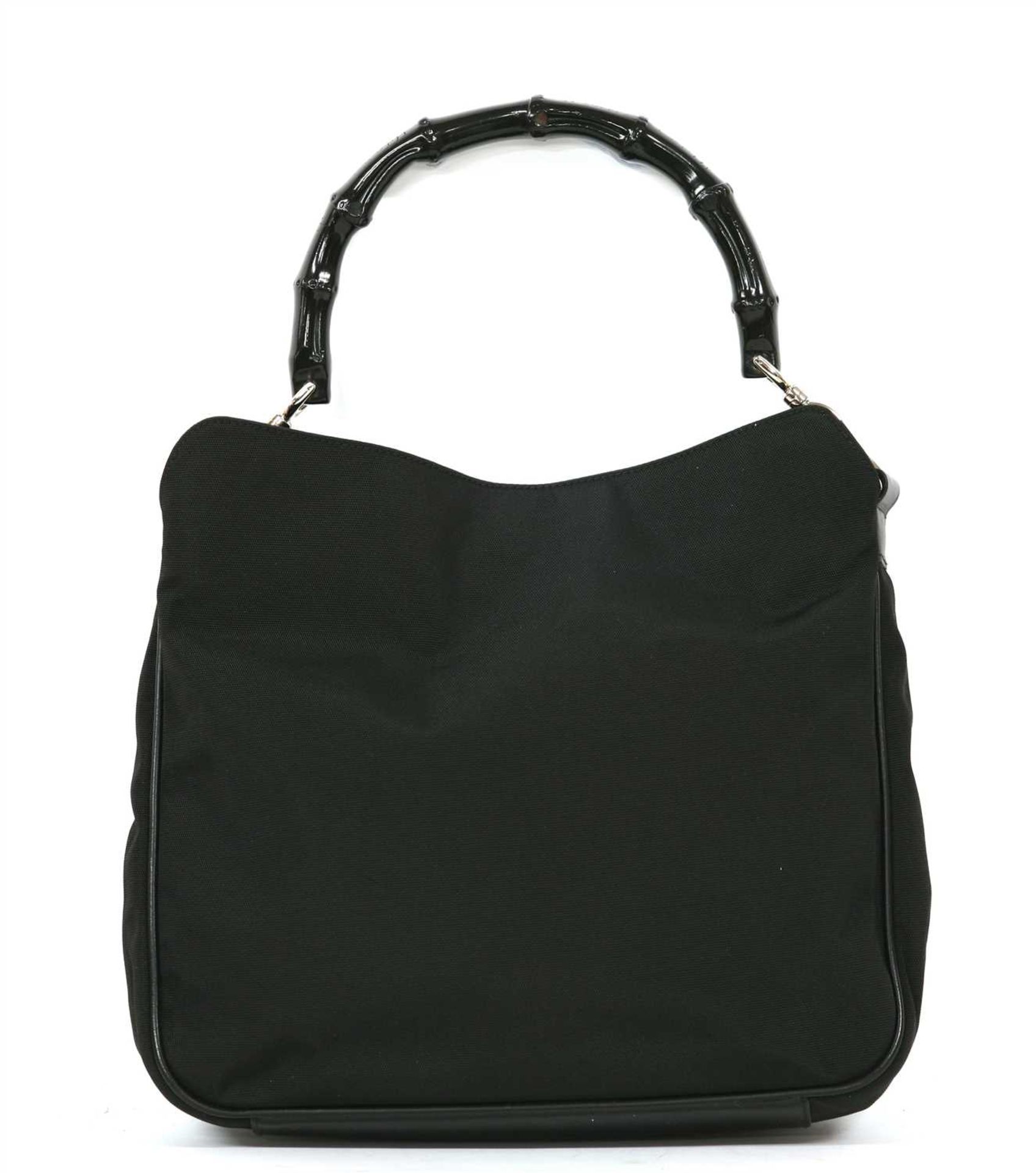 A Gucci black canvas bamboo handbag,