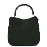 A Gucci black canvas bamboo handbag,