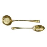 A silver punch ladle and a basting spoon,