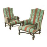 A pair of Victorian walnut library armchairs