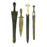 Antiquities: four bronze daggers,