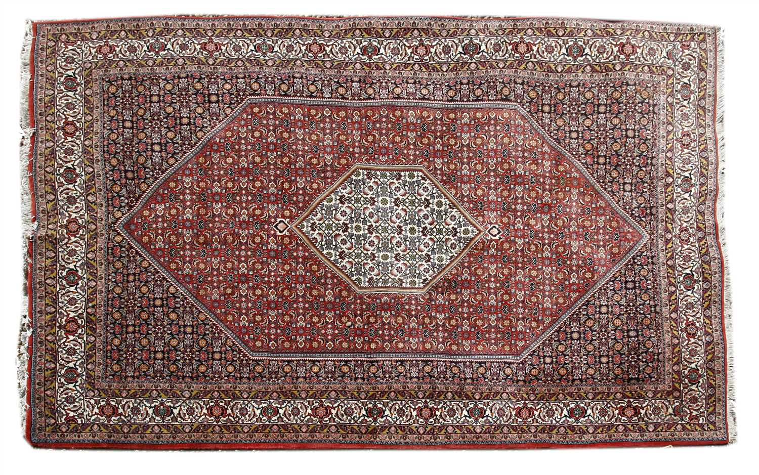 A South West Persian red and navy ground rug