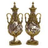 A pair of rouge marble and ormolu-mounted urns,