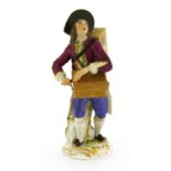 A Meissen porcelain figure of an hurdy-gurdy player,