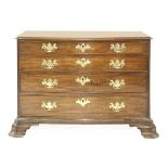 A serpentine mahogany commode chest,