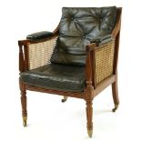 A George III bergère library chair,