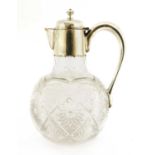 A silver-mounted cut glass claret jug,