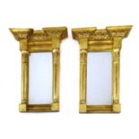 A pair of small pier mirrors