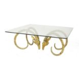 A contemporary brass and glass coffee table,