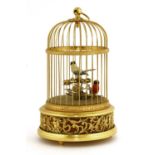 A Reuge musical birdcage automaton,