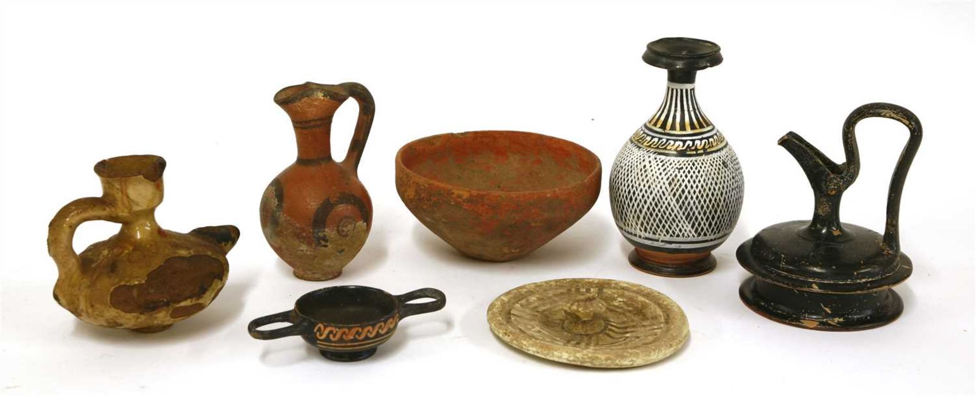 Antiquities: seven ancient clay artefacts,