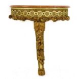 A carved and gilt painted console table