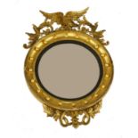 A Regency giltwood convex wall mirror