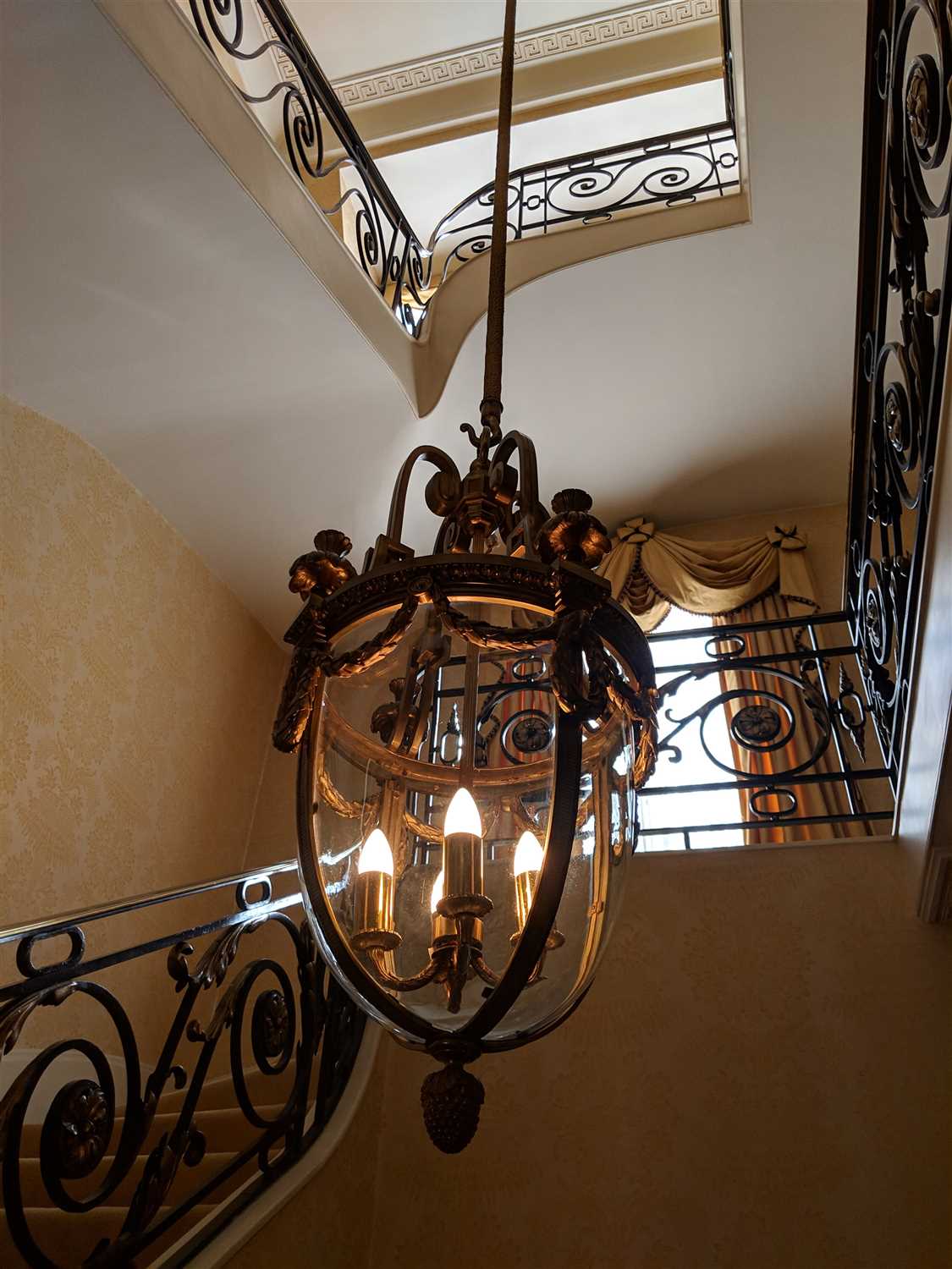 A large Louis XVI-style ormolu and glass hall lantern,