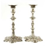 A pair of George II silver candlesticks