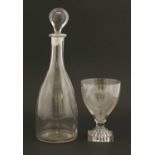 A glass decanter,