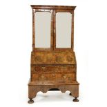 A walnut, feather-banded and fruitwood bureau cabinet on stand