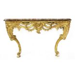 A carved giltwood and marble-topped console table,