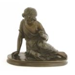 A bronze of a seated girl