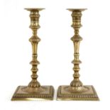 A pair of George II silver candlesticks