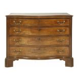 A George III mahogany serpentine commode chest