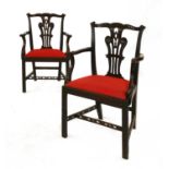 A pair of Chippendale-style mahogany elbow chairs,