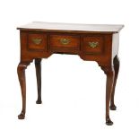 An early George II oak and crossbanded lowboy