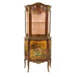 A French serpentine-fronted gilt metal-mounted display cabinet,