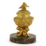An ormolu inkwell, cover and liner