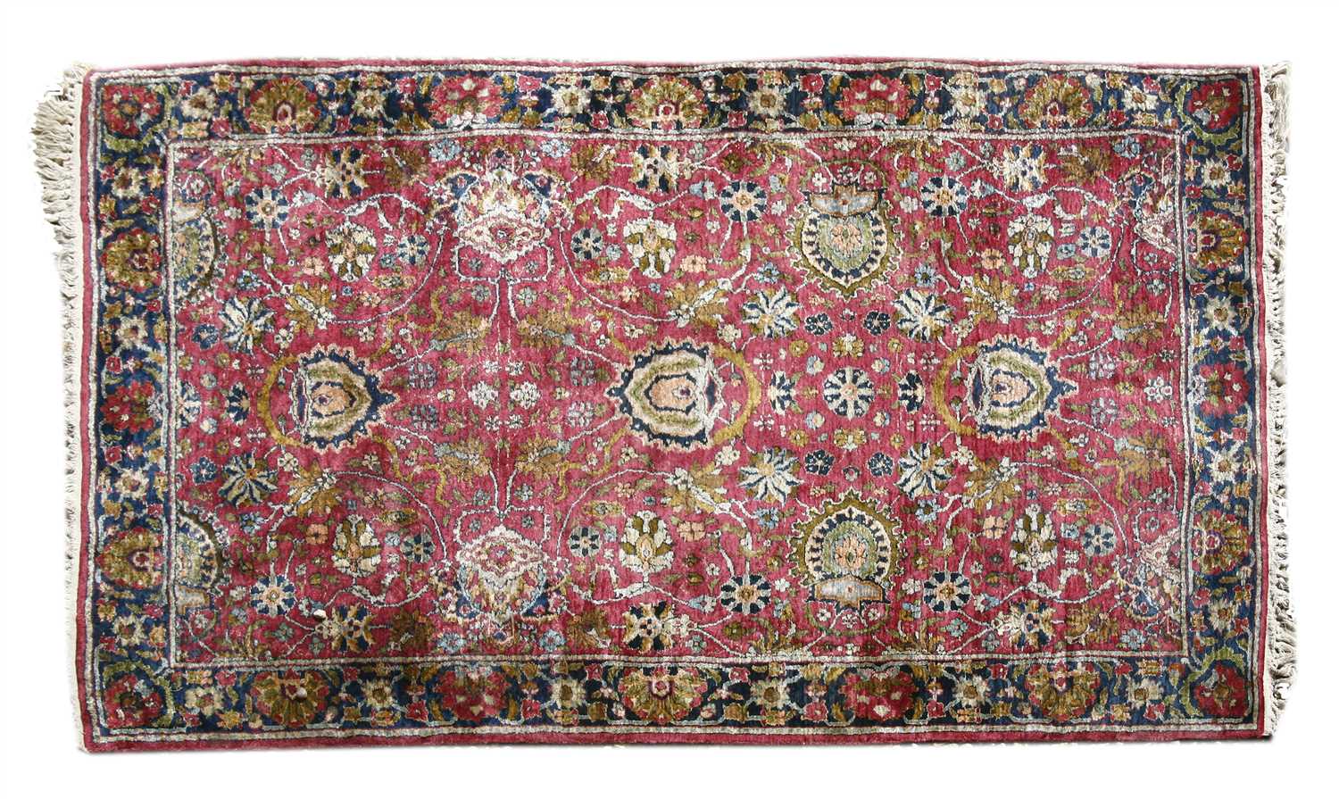 A Persian silk and woollen rug,