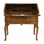 A figured walnut bureau on stand,