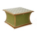 A mahogany and upholstered ottoman,