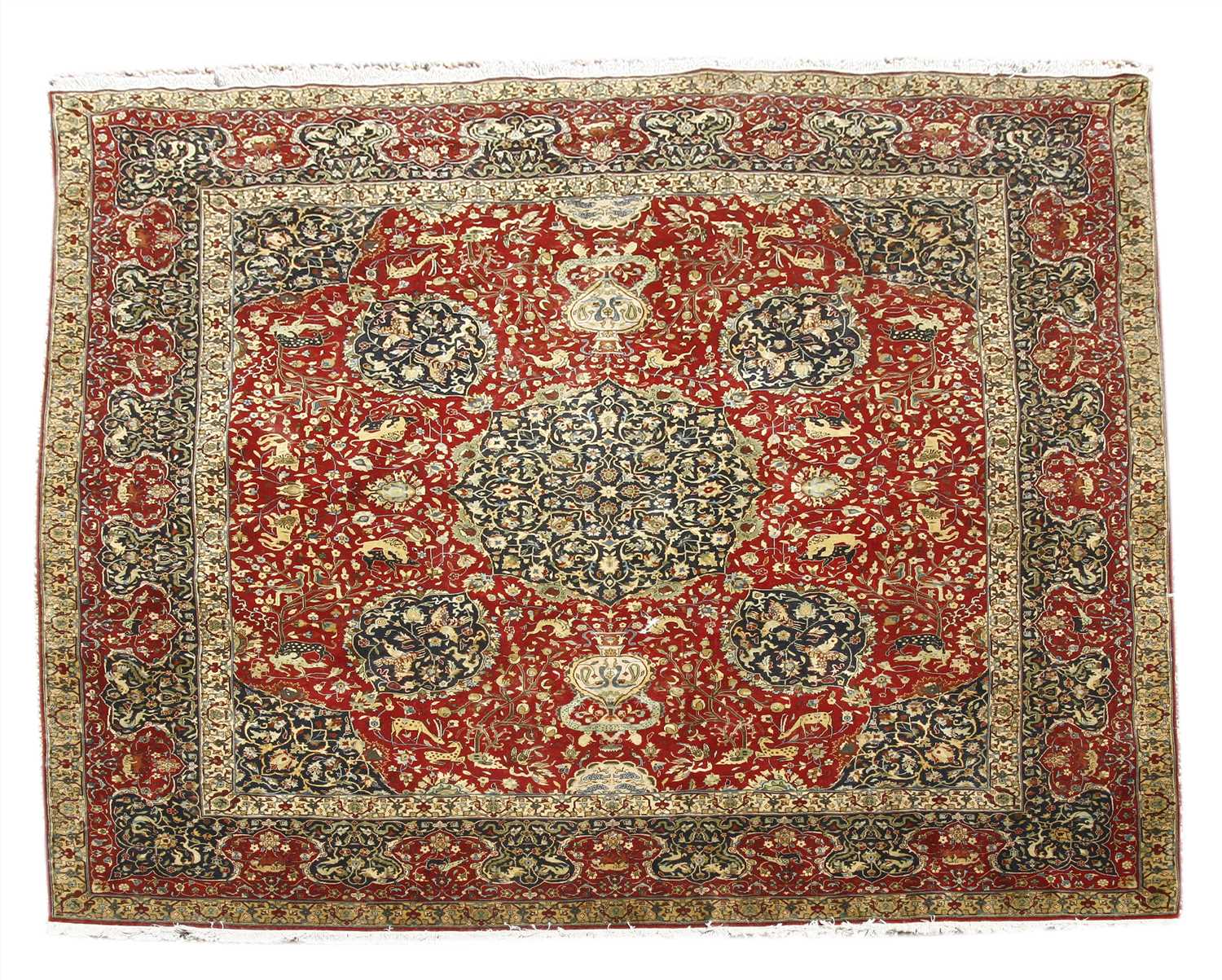 A Persian design woollen carpet,