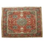 A Persian design woollen carpet,