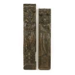 A pair of carved oak term figures,