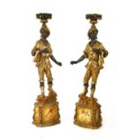 A pair of Florentine-style carved wooden blackamoor torchères,