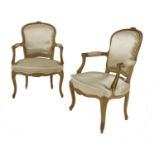 A pair of French beech armchairs,