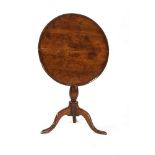 A George III burr elm, walnut and beechwood tripod table